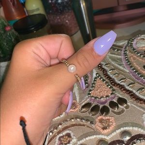 gold ring with pearl on top